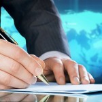 Resized-960x-bigstock_Businessman_s_hand_with_a_pen__13808129